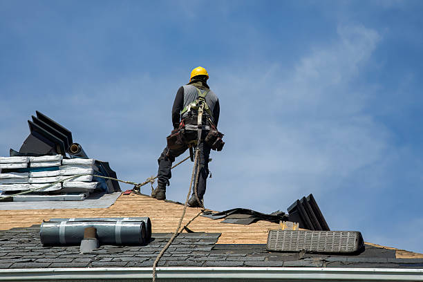Professional Roof Replacement technician working in Bridgehampton, NY